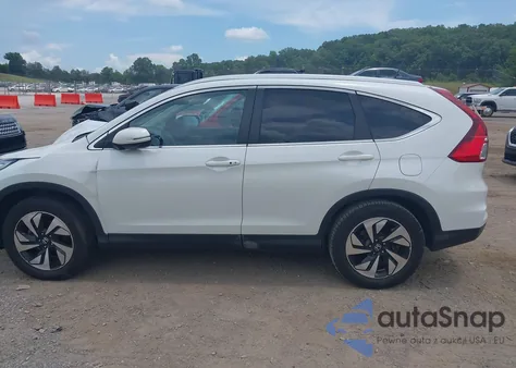 2016 Honda Cr-V Touring z USA, uszkodzony, nr VIN 5J6RM4H95GL118070